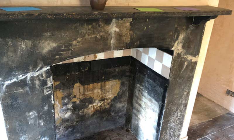 Blackened fireplace.