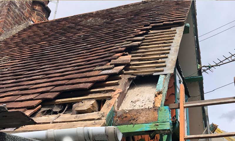 Roof with tiles missing.